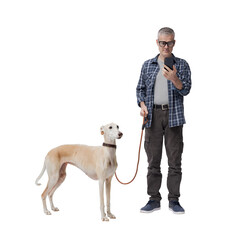 Pet owner walking the dog and checking the smartphone