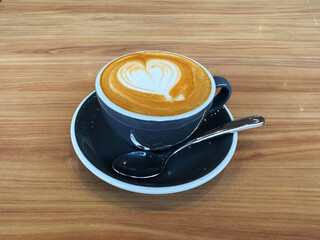 hot milk tea local traditional coffee kopi cappuccino mocha expresso latte in small blue cup on wood table hot beverage menu for cafe restaurant kopitiam