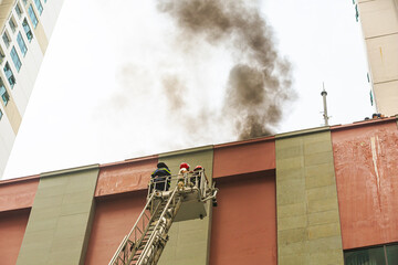 Fire and rescue drill in Nha Trang, Vietnam. Firefighters use different types of evacuation of...