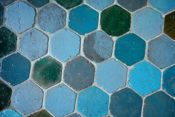 pentagonal-shaped blue mosaics on the floor