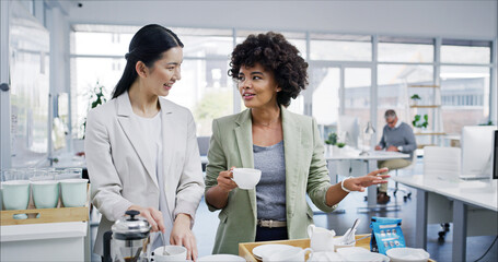 Happy women, coffee break and office with cup, relax and comfort for conversation for accounting firm. Female people, smile and drinking tea for lunch in kitchen, business or company for hot beverage