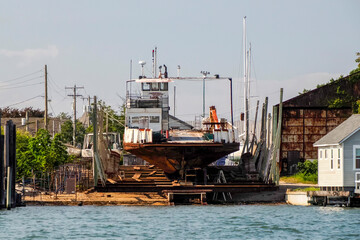 old abandoned rusted ship in harbor port of greenport long island new york