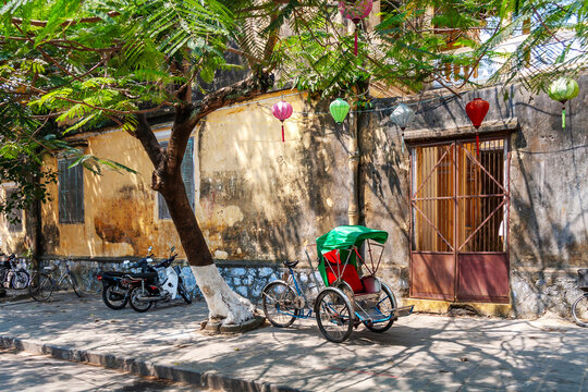 Traditional cyclo parked on the pavement, Hoi An, Vietnam
