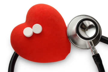Red heart, stethoscope and pills