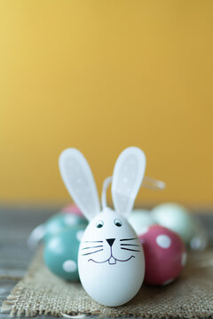Easter bunny in front of Easter eggs