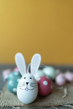 Easter bunny in front of Easter eggs