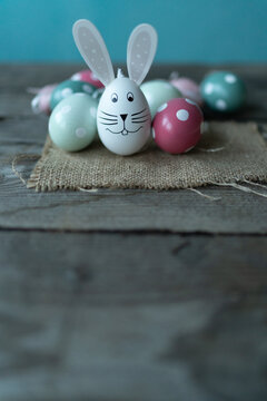 Easter bunny in front of Easter eggs