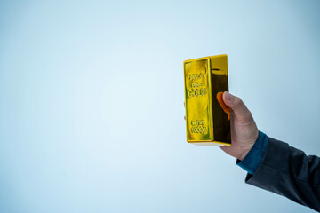 Gold bar stock photo, picture and photo on black table at night.