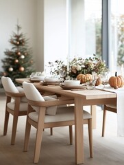 Festive autumn dining table setting with pumpkins, flowers, and Christmas tree.