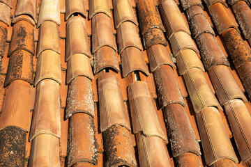 This is a closeup view showcasing a roof that has many tiles on it
