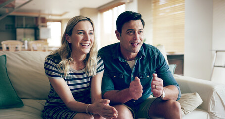 Excited, game and tv with couple, home and live streaming sport on living room sofa. Competition, lounge and fan with watching, waiting and entertainment from team support and motivation in match