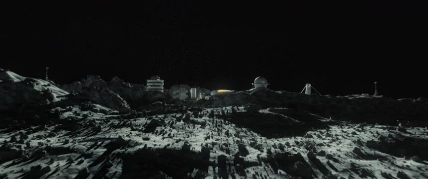 Moon surface with a lunar base on the horizon