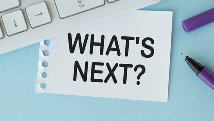 What's next and business concepts with paper and accessories on table