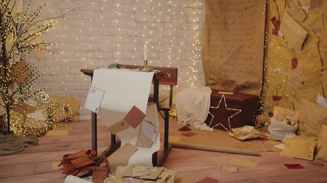 Festive workspace with envelopes, string lights, and decorative elements for Christmas