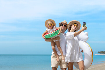 Family happy walking selfie photo with camera smartphone on beach children mother father travel summer vacation together sea holiday tropical. Trip enjoying bonding..