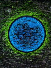 Circle of colour on stone wall