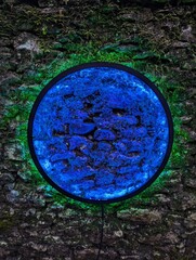 Circle of colour on stone wall