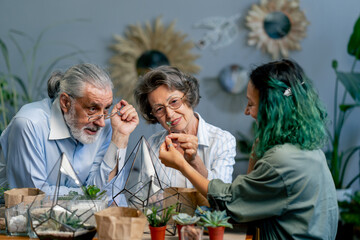 master class on creating compositions from plants for elderly people green-haired teacher happy old age elderly couple pleasant memories leisure time in old age