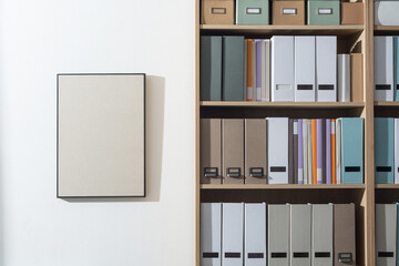 Tidy office interior with bookcase