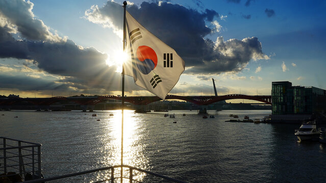 South Korea's National Flag Above the Han River: Seoul's Bridges, Cityscape, and Sunset Clouds - Powered by Adobe
