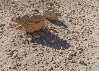 Background of stones on sand. Desert landscape. Alien view. Space surface. Day. Autumn. Egypt.