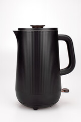 Black compact teapot close-up