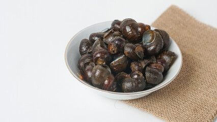 Stir-fried mussels in a small bowl isolated on white background