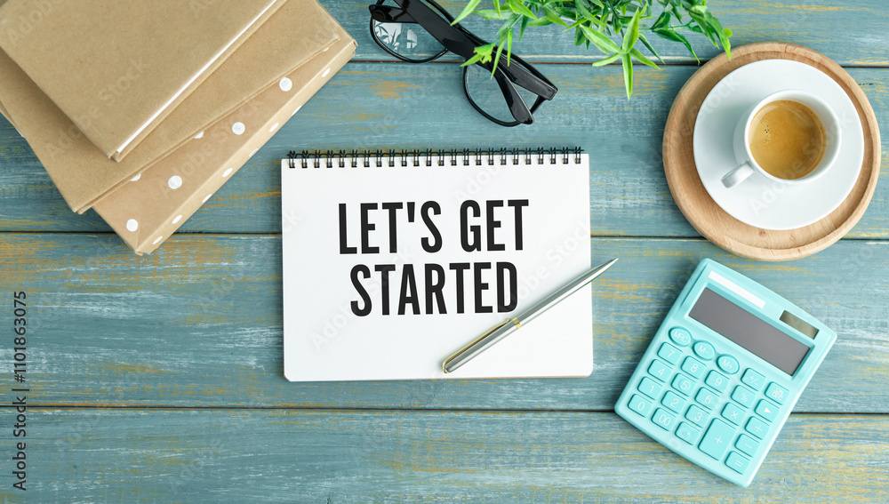 Poster let's get started text concept write on notebook with office tools on wooden background