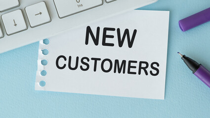 New customers text concept write on paper notebook