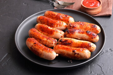 Roasted sausages on plate