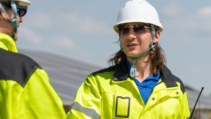 Caucasian electrician, technician, or engineer employed at a solar farm or sungrid plant that promotes clean, renewable energy,sustainable energy concept.