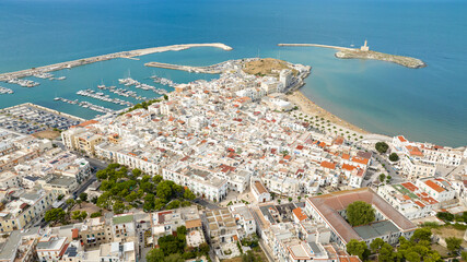 Aerial view of the historic center of the town of Vieste, in Puglia, Italy. It is a tourist destination in Gargano and overlooks the Mediterranean Sea.