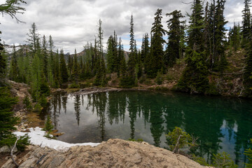 Snow-capped Mountains and Reflective Lake in a Stunning Alpine Landscape.