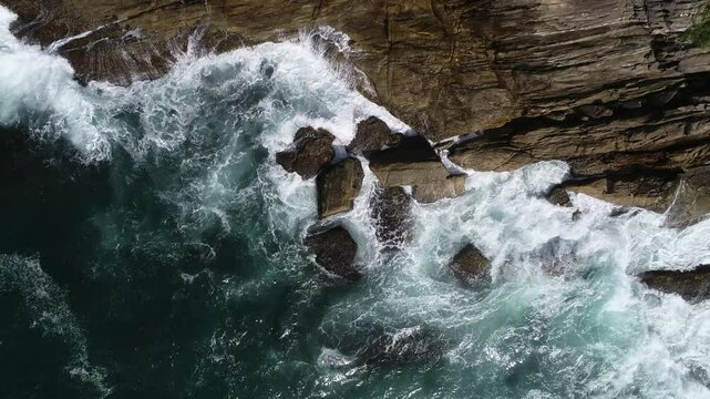 Aerial view of waves in the rocks