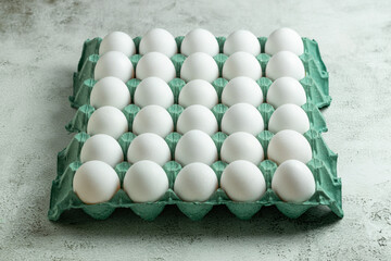 White eggs in cardboard box. Egg box.