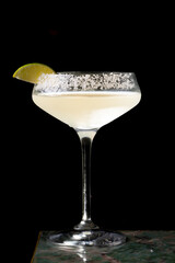 
Cocktail with salt on the glass and lime.