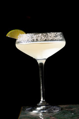 
Cocktail with salt on the glass and lime.