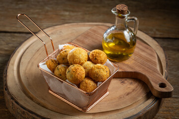 Codfish dumplings. fried dumpling, cod dumpling, fish meat, bacalao bunuelos.
