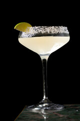 
Cocktail with salt on the glass and lime.