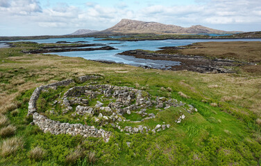 Bagh nam Feadhag prehistoric site. Mainly visible is Iron Age wheelhouse. Grimsay, Outer Hebrides. Outer semi-circle wall is modern. View NE to Eaval © David Matthew Lyons