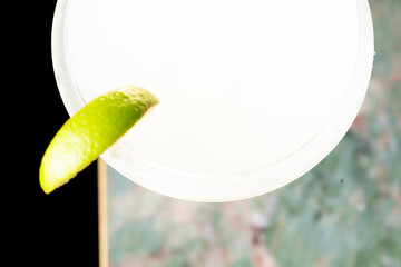 
Cocktail with salt on the glass and lime.