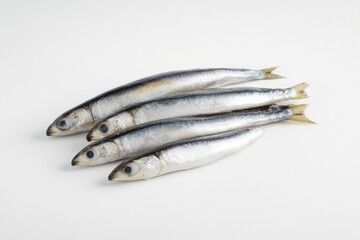 A collection of fish swimming and resting on a white surface