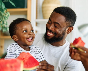 child family kitchen food boy son father watermelon fruit slice summer organic meal fun preparing healthy diet eating home black