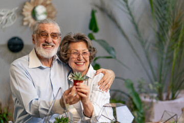 close up master class on creating compositions with plants for elderly people happy old age elderly couple pleasant memories leisure time in old age hugs each other