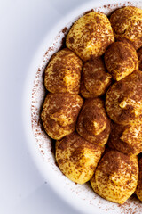 Classic italian dessert, tiramis&ugrave;. An cheescake with cocoa, eggs, coffee and italian biscuits, savoiardo.