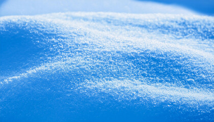 Obraz premium Thick layer of snow on blue background. Snow texture. For Christmas and winter holidays.