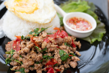 Stir fried Thai basil with minced pork and a fried egg. 