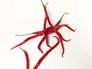 a bunch of fresh big red chilies isolated on white