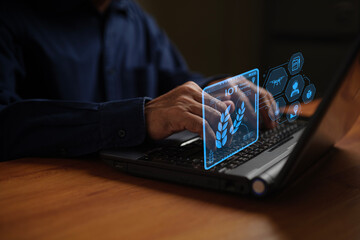 The Internet of Things a man working on computer laptop with digital icons representing the Internet of Things demonstrates modern technology and connectivity in a digital environment.