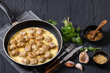 Ground poultry meatballs in a white cream gravy